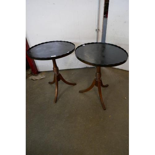 105 - A pair of mahogany tripod wine tables