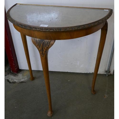 115 - A burr walnut demi lune hall table