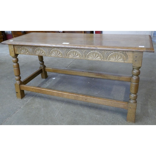 150 - A small 17th Century style carved oak bench