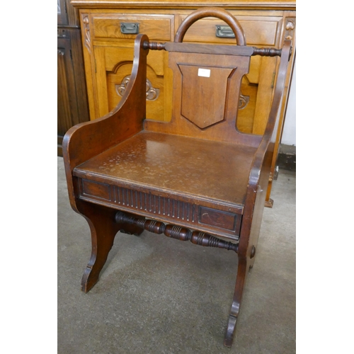 161 - A Victorian Aesthetic Movement oak hall chair