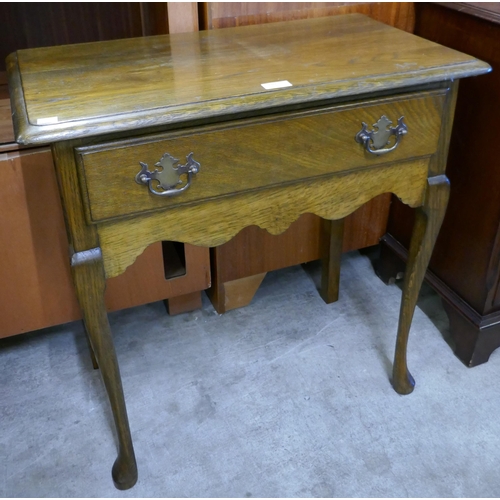 180 - A George II style oak single drawer side table