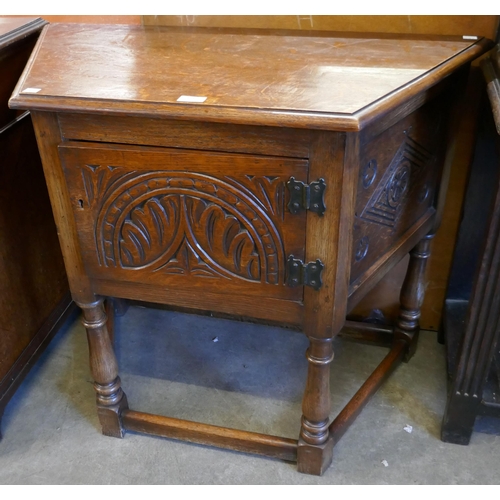 184 - A carved oak credence cupboard