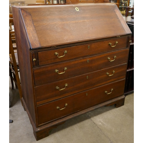 195 - A George III oak bureau