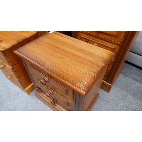 1497 - Two three drawer bedside chests and a pine four drawer dressing table