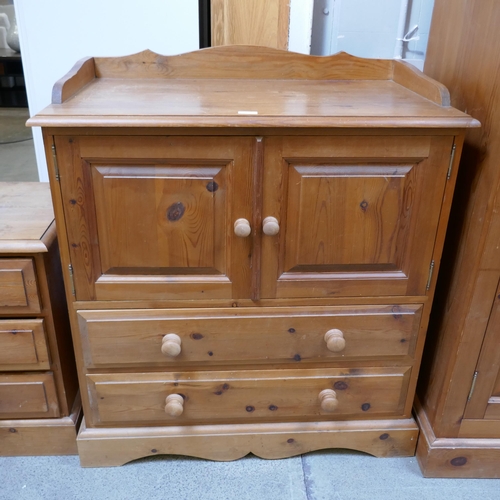 1500 - A pine bedside chest and a pine two door two drawer chest