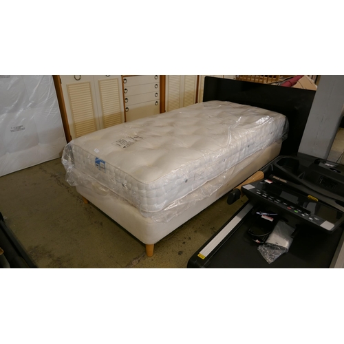 1520 - A cream fabric single divan bed with mattress