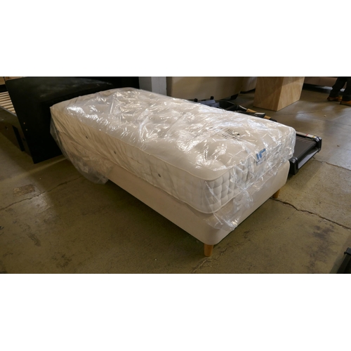 1520 - A cream fabric single divan bed with mattress