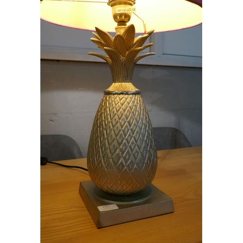 1331 - A metal pineapple lamp with pink shade