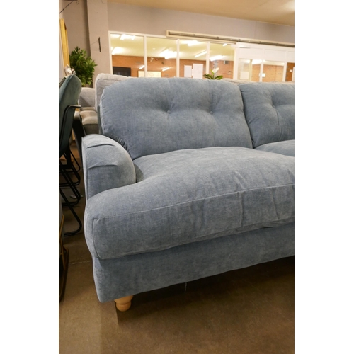 1333 - A steel blue velvet three seater sofa RRP £949