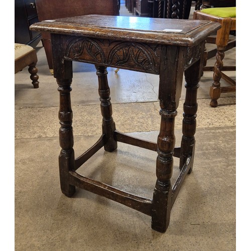 209A - A Charles II carved oak joint stool