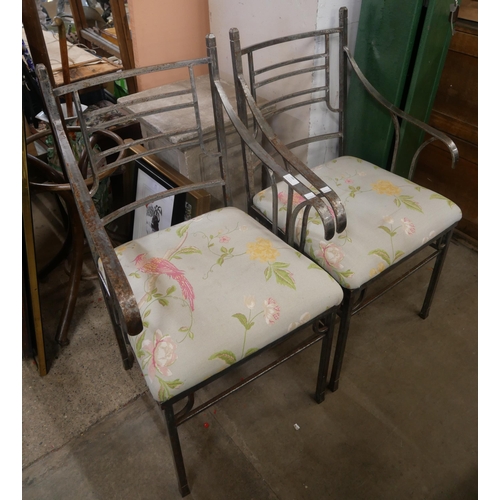 214A - A pair of cast iron garden chairs