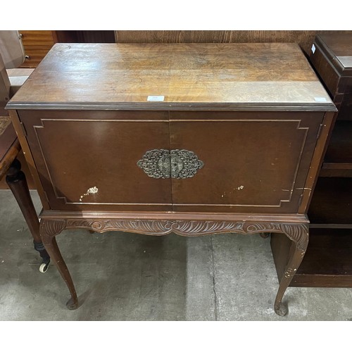 166 - A French style walnut cocktail cabinet