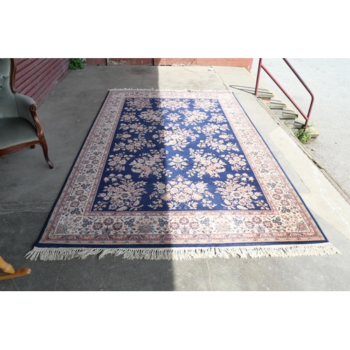 220 - A blue ground rug