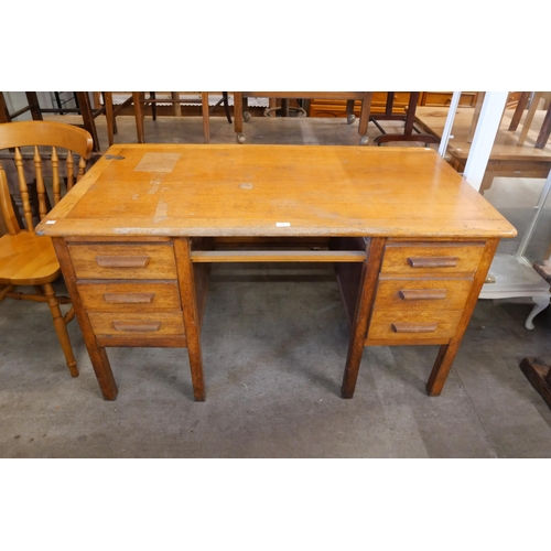 239 - An oak desk and a painted display cabinet