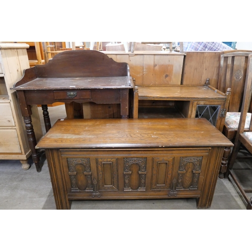 243 - A Victorian stained pine washstand, a 17th Century style carved oak blanket box and a trolley