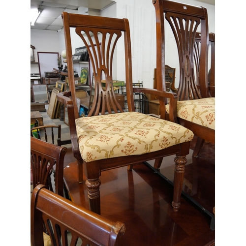 249 - A mahogany extending dining table and eight chairs