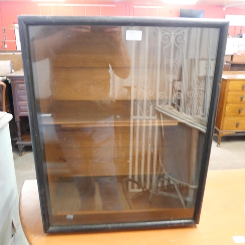 255 - An ebonised display cabinet