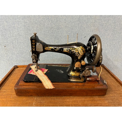 335 - A cased sewing machine