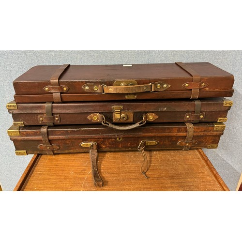 336 - Three Victorian fitted leather gun cases