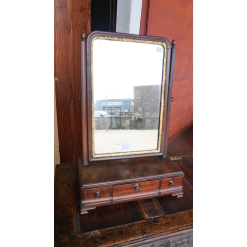 211 - A George III mahogany and parcel gilt toilet mirror