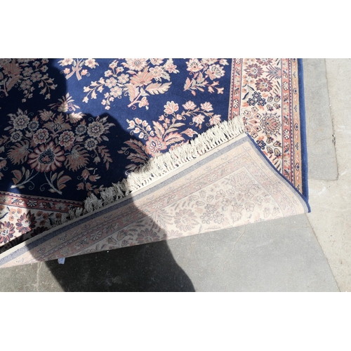 220 - A blue ground rug