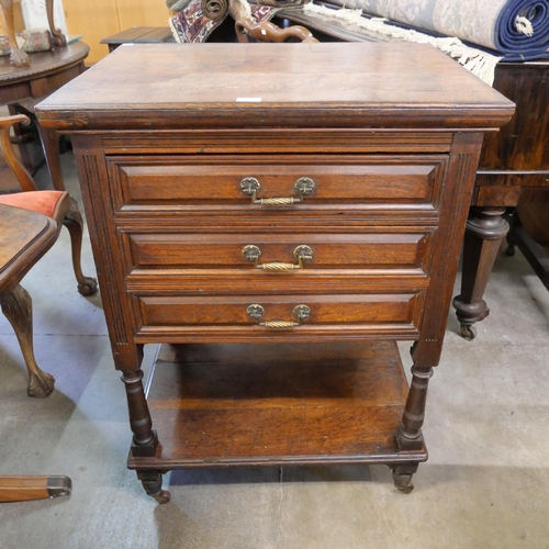 223 - A Victorian Aesthetic Movement oak three drawer chest