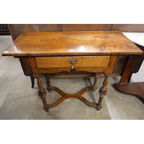 224 - A George I style oak single drawer side table