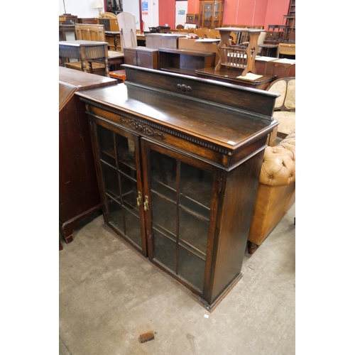 227 - An early 20th Century oak two door bookcase