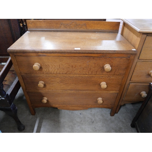 232 - A Cotswold style oak chest of drawers