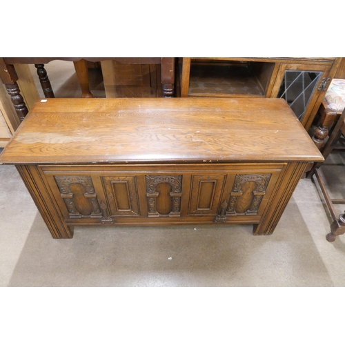 243 - A Victorian stained pine washstand, a 17th Century style carved oak blanket box and a trolley