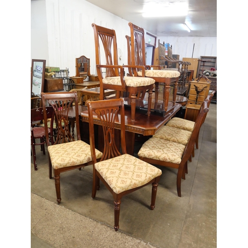 249 - A mahogany extending dining table and eight chairs