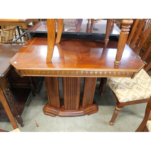 249 - A mahogany extending dining table and eight chairs