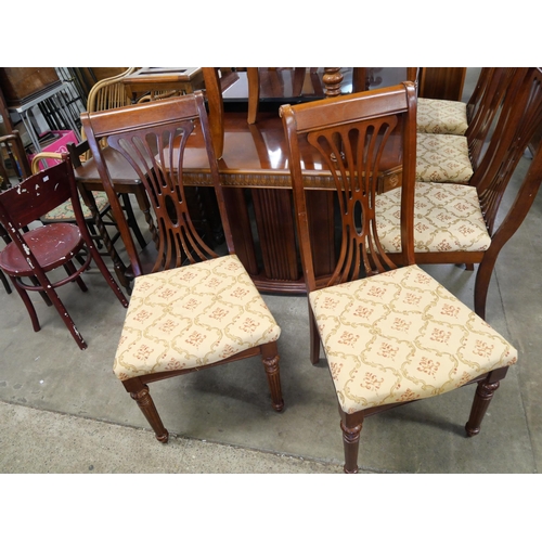 249 - A mahogany extending dining table and eight chairs