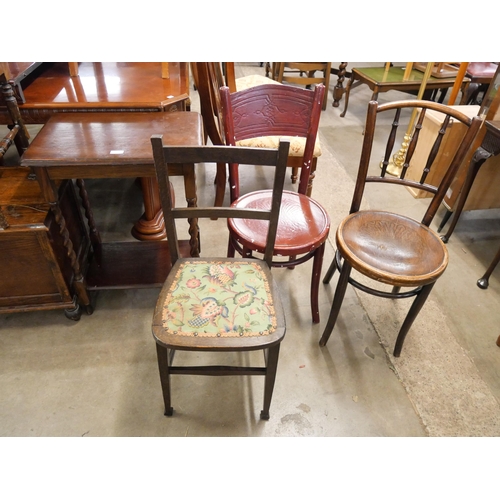 261 - An oak barleytwist occasional table and three assorted chairs