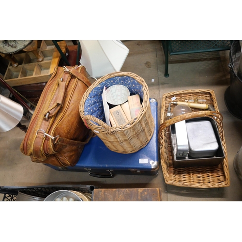 310 - A briefcase, leather work satchel and baskets with assorted picnic ware and a Cona Coffee maker