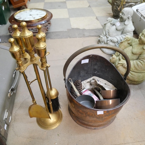 313 - A copper coal scuttle, brass companion set, copper pans, etc.