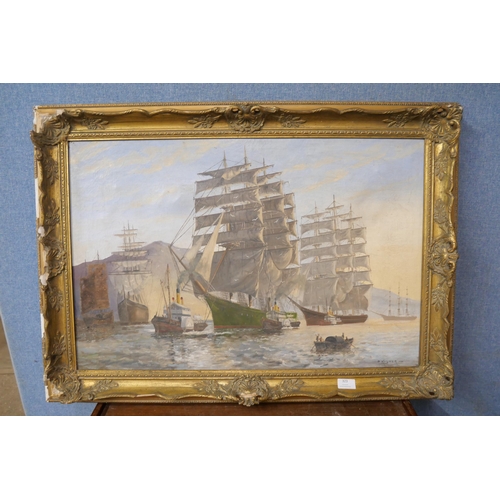 323 - Philip Kilner (fl.1920-1940), galleons in a harbour, oil on canvas, framed