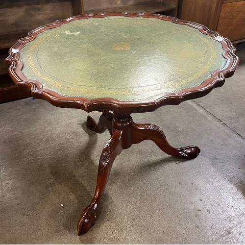 200A - A Regency style mahogany and green leather topped tripod coffee table