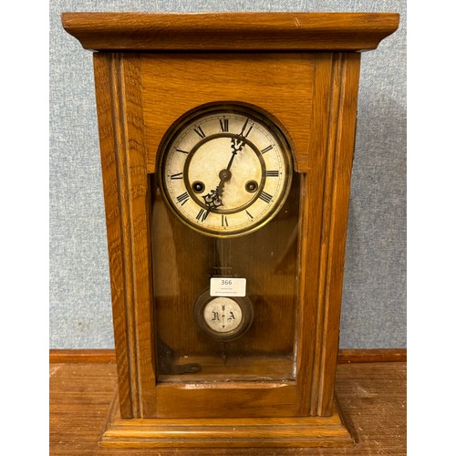 366 - An early 20th Century oak wall clock