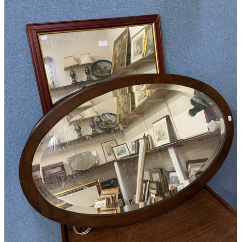 370 - Two oak oval framed mirrors and one other