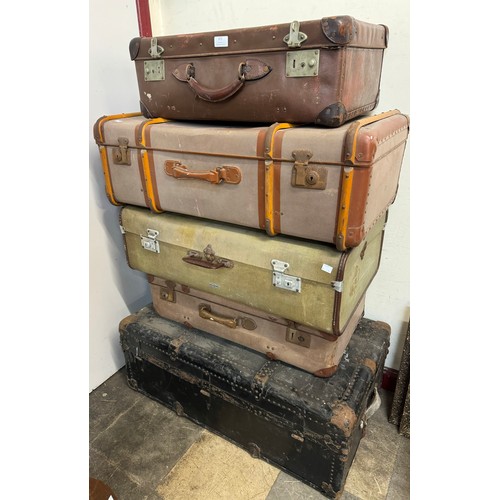 371 - Four suitcases and a steamer trunk