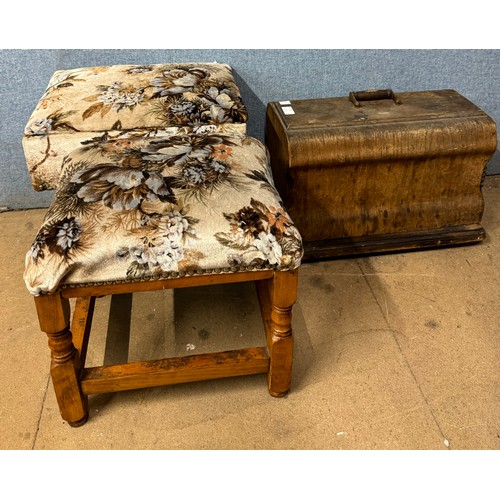 379 - A cased sewing machine, sewing box and a footstool