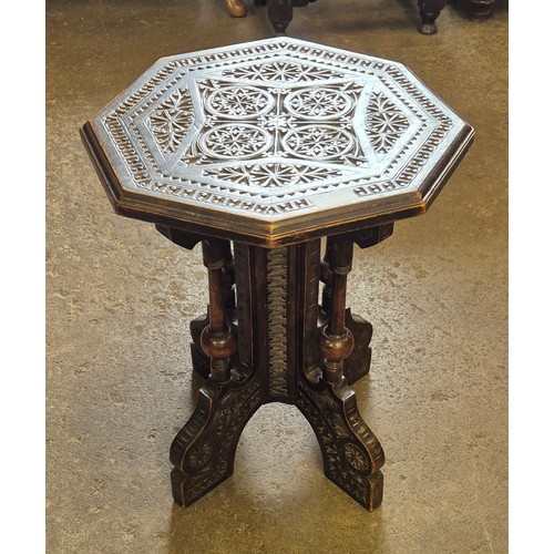 185 - A Victorian Aesthetic Movement carved mahogany octagonal occasional table