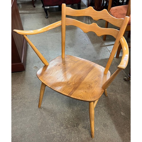 3 - An Ercol Blonde elm and beech 493 model elbow chair