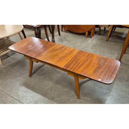 11 - A walnut rectangular extending coffee table