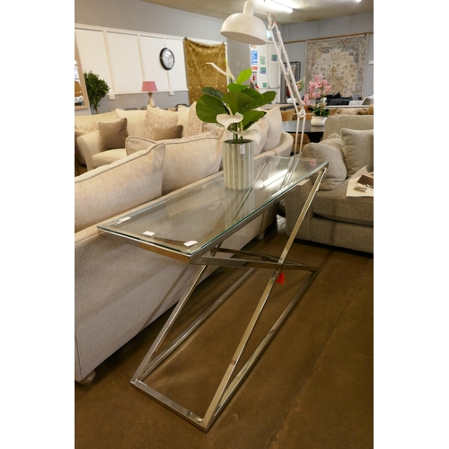 1313 - A Glass and Chrome Console Table *This lot is subject to VAT