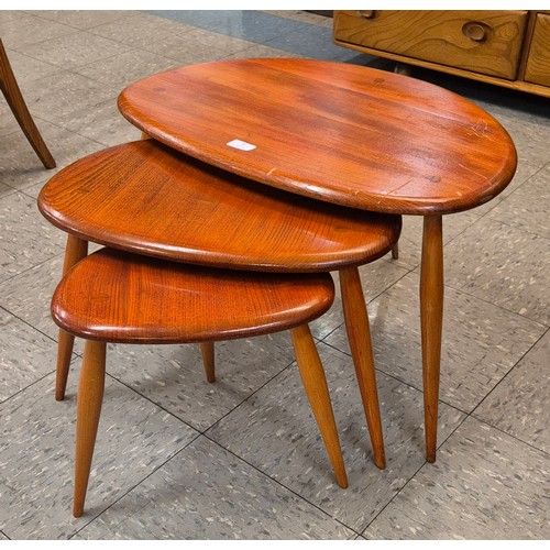 36 - An Ercol elm and beech pebble shaped nest of tables