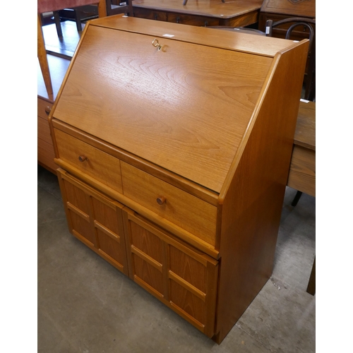 83 - A Nathan teak bureau and a teak stereo cabinet