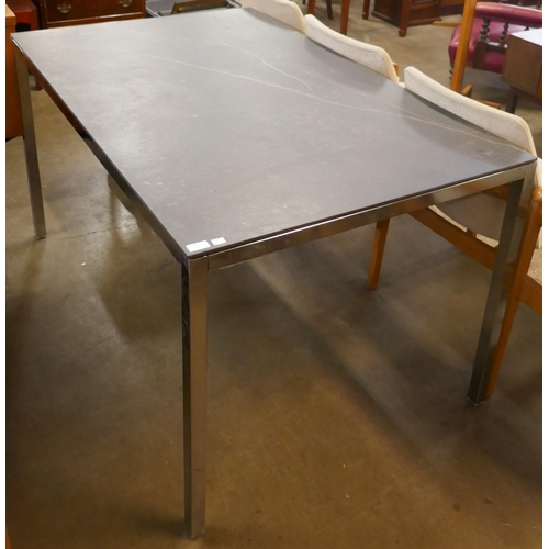 91 - A chrome and slate topped rectangular dining table