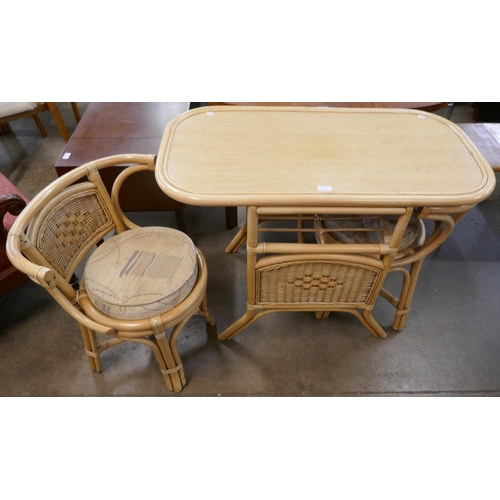 92 - A wicker and rattan table and two chairs